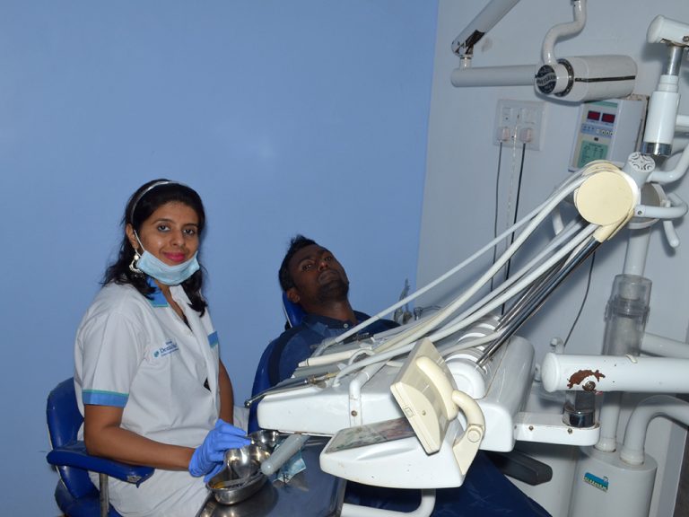 A dentist treating a patient at South Mumbai clinic