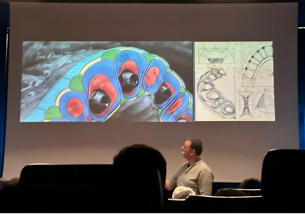 A man is presenting on a screen