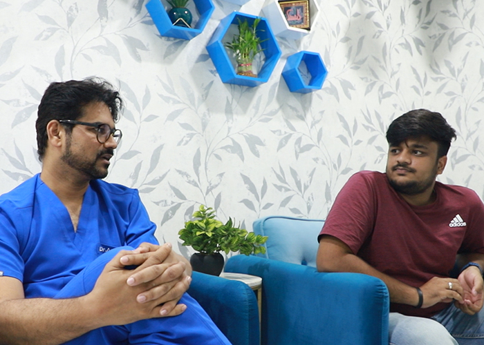 Dr. Aslam Inamdar talking with a patient