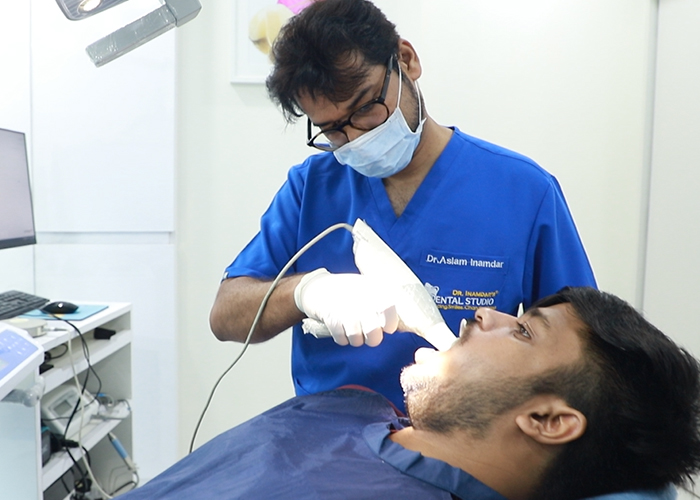 Dr. Aslam Inamdar treating a patient